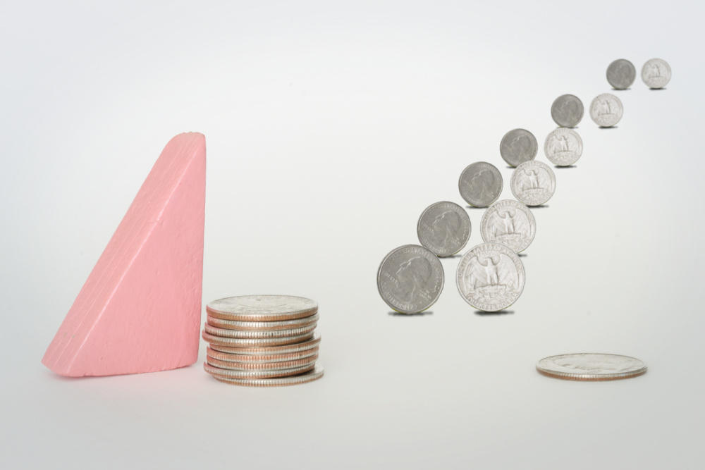 Flow FP's block woman beside a stack of quarters. A second, smaller stack represents a company match. Matches pairs of quarters, one from each stack, walk into the distance.