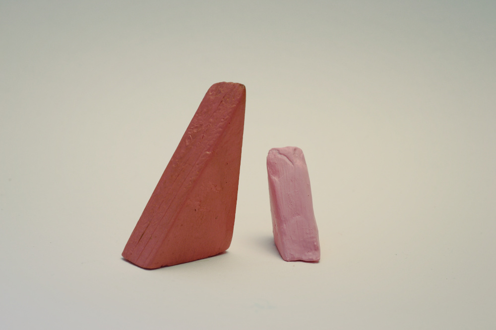 A large dark pink triangle Block Woman is positioned near a smaller light pink triangle Block Child